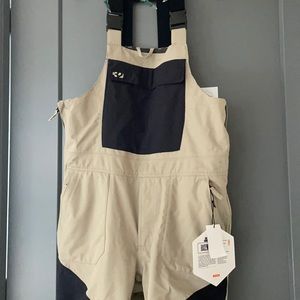 Thirty-two snowboarding bibs